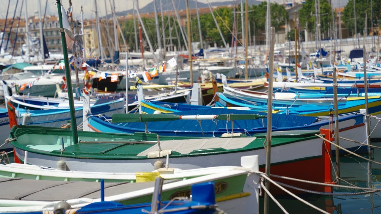 4K Colorful Sailing Boats and Fishing Boats in a Marina Harbor