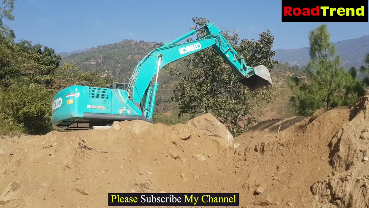 Excavator opening the big track for road construction in HILL