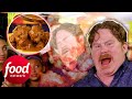 Casey Starts To Lose It While Eating These Jerk Wings Smothered In Ghost Pepper Sauce | Man V Food