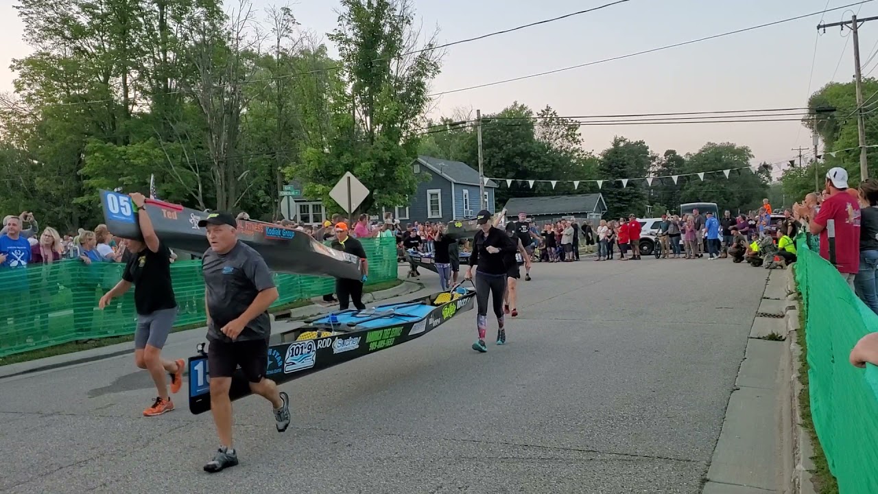 2021 Ausable Canoe Marathon Sprint to the water. Grayling Michigan