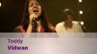 Toddy by vidwan drums - tao issaro bass guitar/horns ben sam jones
guitars vivian varghese backing vocals milan cherian keyboards yakzan
gary pereira...