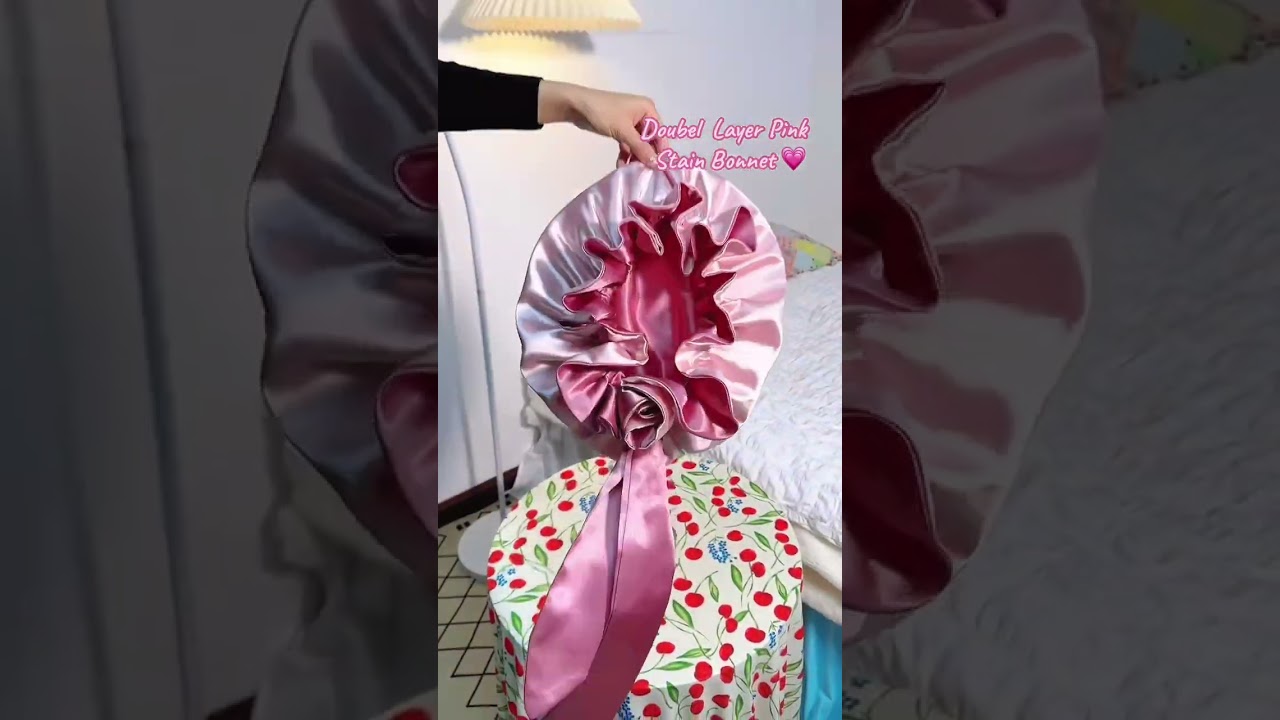 Pink satin bonnet for hair care & styling 