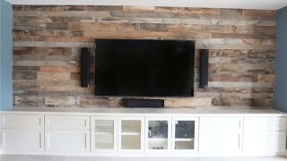 Basement remodel that included a built in entertainment center with the wall above to be finished with reclaimed barn wood.