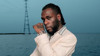 Video of Singer Burna Boy Pounding Yam on the Street Surfaced.