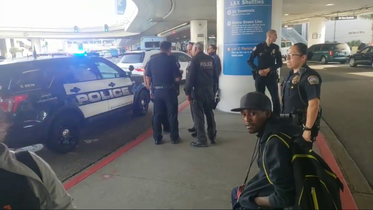 LAX airport police on a wrong suspect stealing luggage at LAX - YouTube