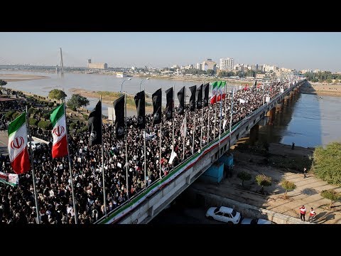 Thousands march in grand funeral procession for Iranian General Soleimani