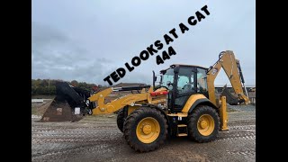 Ted looks at a Cat 444 Backhoe