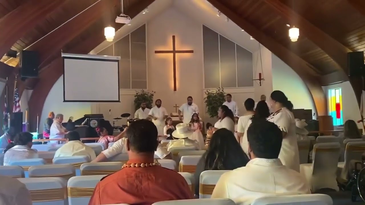 Family walk down song to O le Laulaufaiva 