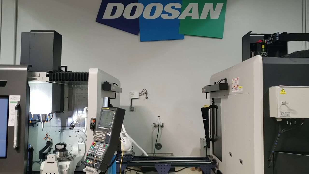 Doosan DVF5000 2 machine Cobot Cell Demo - YouTube