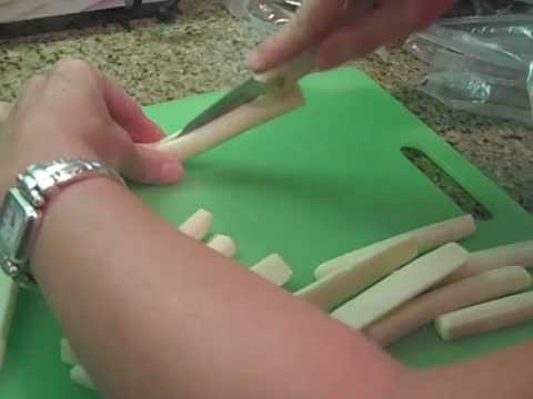 Cutting the string cheese for the pizza rolls