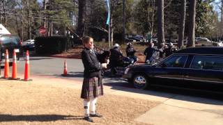 Bagpipes play at memorial service for A.B. Martin