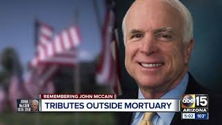 Tributes and mementos left outside Phoenix mortuary honoring John McCain