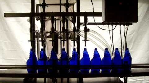 Semi-automatic overflow filling machine mounted on a moblie cart