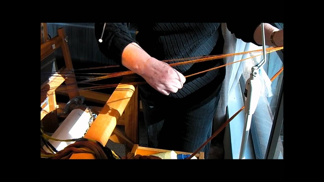 Winding a dyed wool warp onto a loom.wmv