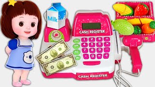 Baby Doli and cash register mart shopping