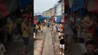 Taking the train through the Maeklong Train Market #travel #thailand #maeklongrailwaymarket