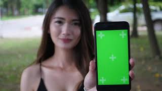 Girl holding digital tablet green screen