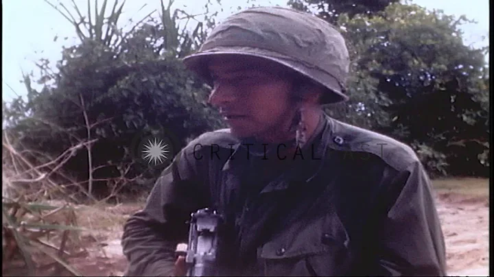 US 1st Infantry Division moves forward on fields in Vietnam. HD Stock Footage