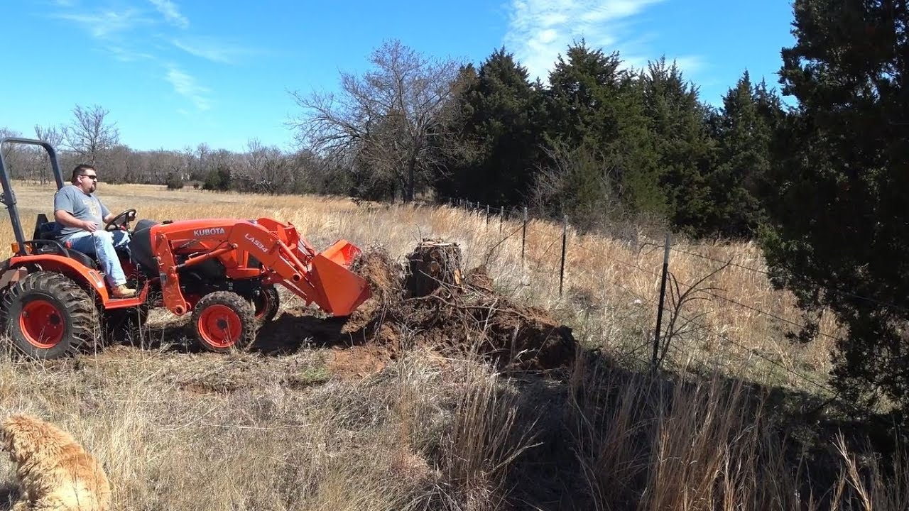 Ep. 39 - Digging Out a Cedar Stump with the Kubota B2650 - YouTube
