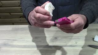 Using a chip resetter to re-set a chip on an Epson printer