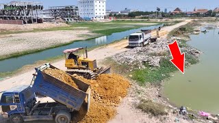 Use technique Processing Filling Up The Land huge, Bulldozer KOMATSU D31P, Dump Truck Unloading