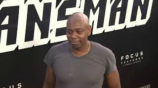 Comedian Dave Chappelle rushed by fan on stage at Netflix show in Los Angeles