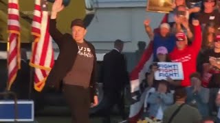 Elon Musk jumps around on stage as he joins Trump at rally