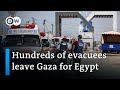 First group of injured Gazans and foreigners cross into Egypt | DW News