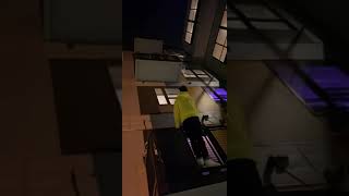 Guy in yellow hoodie hangs from side of balcony then falls and lands on his head