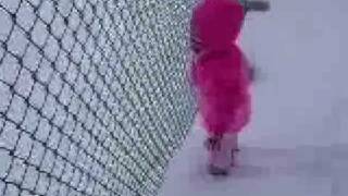 Baby Playing In The Snow