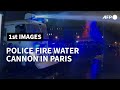 Police use water cannon at Paris protest against security law | AFP