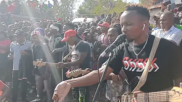 Katombi plays a tribute song during  mukuu burial 100s of people fall from a tree