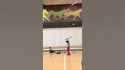 Allan Coy learning how to keep his hands inside the basebal