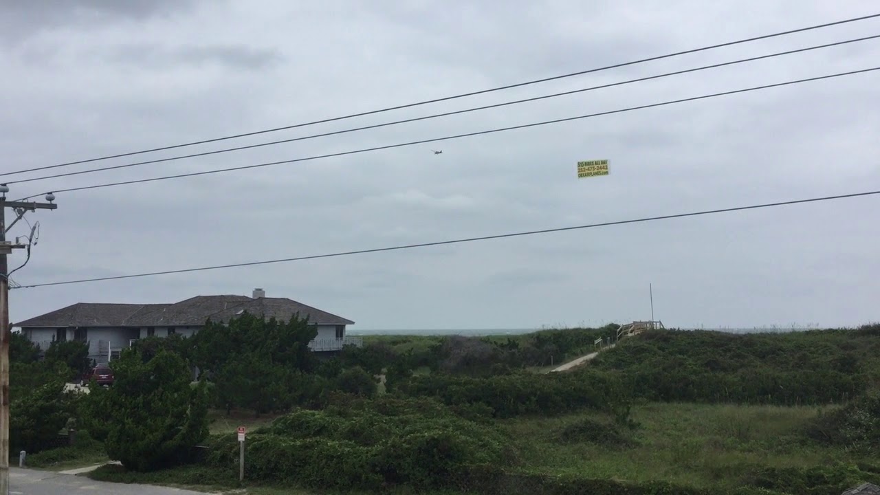 OBX Airplane Rides Banner Plane In Duck NC On A Cloudy Day - YouTube