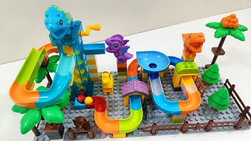 Epic Marble Run Race with Building Blocks & LEGO Duplo  Dinosaur Showdown  Insane 3 Track Combo!