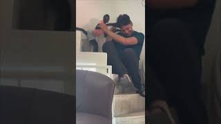 Playful Spider Monkey Playing With a Young Man