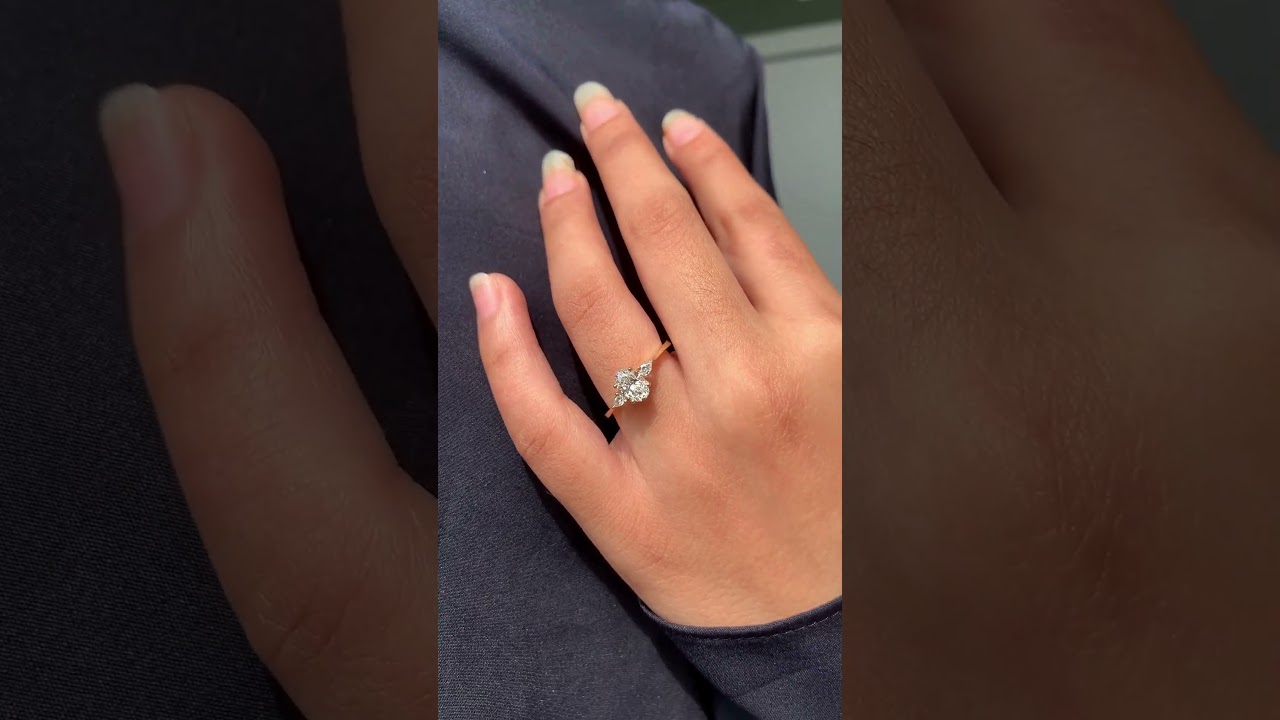 oval and pear-shaped three-stone engagement ring 