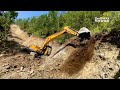 Masterful Techniques for Constructing Steep Mountain Roads Using a Hyundai 220LS Excavator