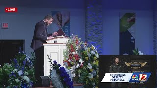 Minister gives message at Deputy Mitchell's funeral