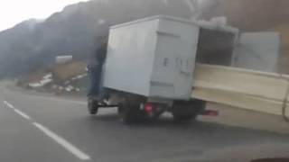 Russian truck drives tipped on 3 wheels