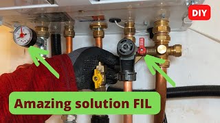 A Plumber shows how to connect a filling-inlet combination to a central heating boiler