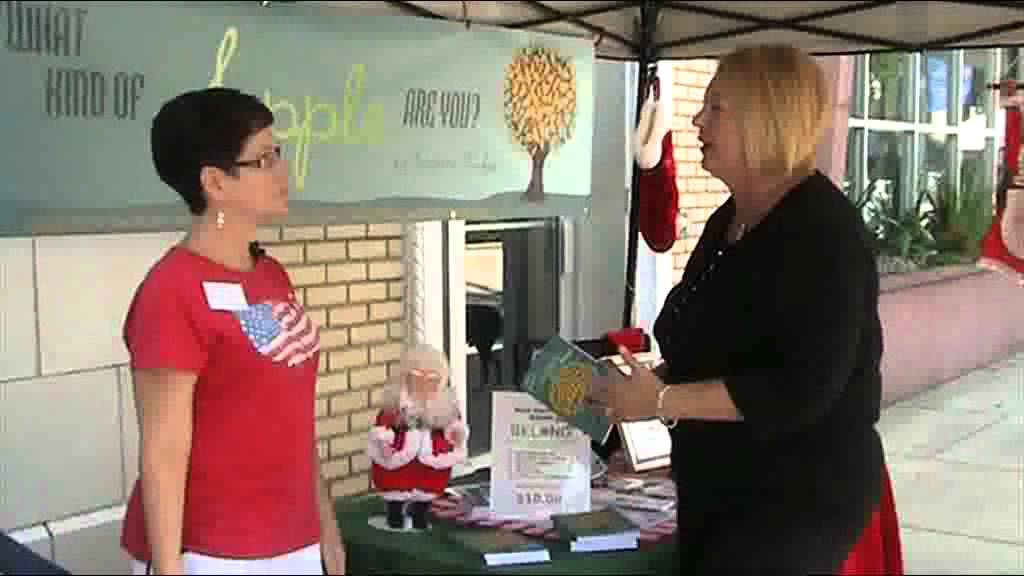 Deb Denys visits with Christmas in July businesses along New Smyrna Beach Canal Street.
