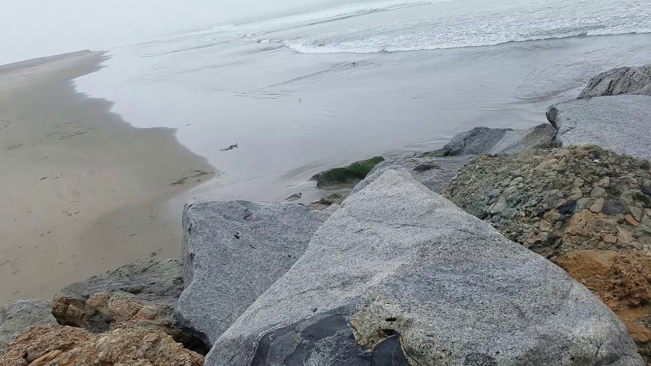 Walking on jetty rocks. - YouTube