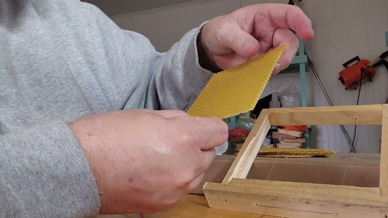 Installing wax foundation in queen mating frames