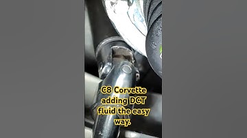 C8 Corvette DCT fluid top off. Drivers side rear wheel well. Car jacked up 15°.