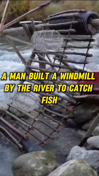 A man built a windmill by the river to catch fish#shorts #youtubeshorts #fishing #fun