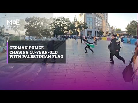 German police chase a 10-year-old boy with Palestinian flag during pro-Palestine protest in Berlin