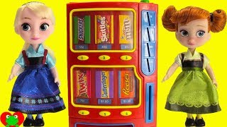 frozen anna buys candy with elsa and princesses at vending machine