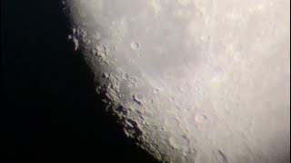 Moon through a Skywatcher Travelstar 102 refractor with an iphone 8 pressed against the eyepiece