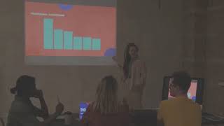 Young professionals share ideas during a business presentation.